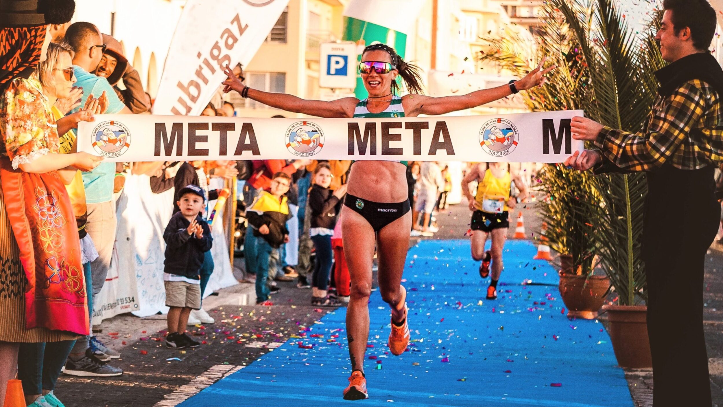 woman crossing a marathon finish line